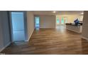 Bright living room featuring hard wood flooring, ample natural light and neutral wall color at 41 W Emily Gardens Dr, Selma, NC 27576