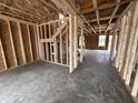 Interior view of new construction home showing wood framing and staircase construction at 43 Chloe Ct, Selma, NC 27577