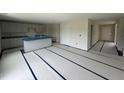 Open kitchen design with center island, gray cabinets, and granite countertops at 43 Chloe Ct, Selma, NC 27577