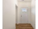 Bright entryway with hardwood floors and white trim at 46 Lupin Dr, Smithfield, NC 27577