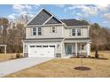 Charming two-story home with a two-car garage and stone accents at 46 Lupin Dr, Smithfield, NC 27577