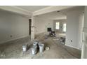 Living room with fireplace, boasting ample space and natural light at 47 Royal Ave, Selma, NC 27576