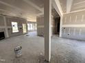 Spacious living room with fireplace and natural light streaming through large windows, under construction at 47 Royal Ave, Selma, NC 27576