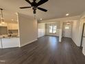 Open-concept living area with hardwood floors, recessed lighting, and abundant natural light at 47 Royal Ave, Selma, NC 27576