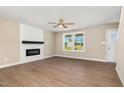 Bright living room featuring hardwood floors, fireplace, and natural light at 48 Silver Ct, Smithfield, NC 27577