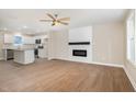 Open concept living room and kitchen with stainless steel appliances and hardwood floors at 48 Silver Ct, Smithfield, NC 27577