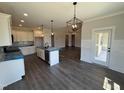 Spacious kitchen with white cabinets, a center island, and stainless steel appliances at 56 Bailey-Boykin Rd, Selma, NC 27576
