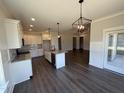 Modern kitchen featuring granite countertops, stainless steel appliances, and a kitchen island at 56 Bailey-Boykin Rd, Selma, NC 27576
