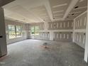 Bright, spacious living room featuring large windows, ready for customization and design at 56 Bailey-Boykin Rd, Selma, NC 27576