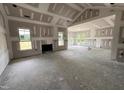 Bright, spacious living room featuring large windows and a fireplace, ready for customization at 56 Bailey-Boykin Rd, Selma, NC 27576