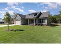 Beautifully landscaped single-Gathering home boasting lush green lawn and welcoming curb appeal at 609 Tuscany Cir, Princeton, NC 27569