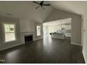 Open living space with fireplace, seamlessly connected to the modern kitchen at 612 Tuscany Cir, Princeton, NC 27569