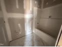 Unfinished bathroom equipped with a new bathtub, ready for you to customize your relaxation space at 71 Royal Ave, Selma, NC 27576