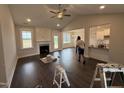 Spacious living room featuring vaulted ceilings, fireplace, and hardwood flooring at 71 Royal Ave, Selma, NC 27576