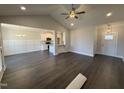 Expansive living room features hardwood flooring, decorative wainscotting, and ample natural light at 71 Royal Ave, Selma, NC 27576