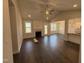 Bright living room boasts hardwood floors, fireplace, vaulted ceiling and open concept layout at 71 Royal Ave, Selma, NC 27576