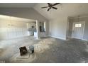 Spacious open-concept boasts a ceiling fan, and views of the kitchen and dining area at 71 Royal Ave, Selma, NC 27576