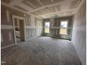 Bright bedroom with two windows and a view of the backyard at 76 Royal Ave, Selma, NC 27576