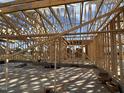 Interior view of a home's wood framing showcasing its structure and construction at 76 Royal Ave, Selma, NC 27576