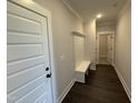Hallway with coat rack leading to other rooms of the house at 76 Royal Ave, Selma, NC 27576
