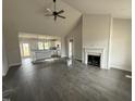 Open-concept living room featuring vaulted ceilings, fireplace, and hardwood floors at 76 Royal Ave, Selma, NC 27576