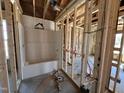 Unfinished bathroom with a white tub/shower installed and plumbing ready for fixtures, awaiting final touches at 8 W Emily Gardens Dr, Selma, NC 27577