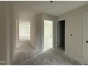 Bright hallway leading to various rooms, showcasing the home's open floor plan at 8 W Emily Gardens Dr, Selma, NC 27577