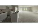 Spacious open-concept kitchen area with white cabinets ready for appliances at 8 W Emily Gardens Dr, Selma, NC 27577