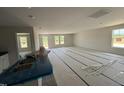 Expansive living room with a view of the kitchen and backyard at 8 W Emily Gardens Dr, Selma, NC 27577