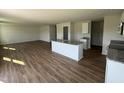 Spacious open kitchen with granite countertops, stainless appliances, island and modern finishes at 82 W Emily Gardens Dr, Selma, NC 27576