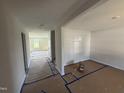 Bright and airy living room featuring neutral paint and ample natural light at 82 W Emily Gardens Dr, Selma, NC 27576