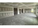 Expansive living area featuring drywall, and ample natural light from several windows at 82 W Emily Gardens Dr, Selma, NC 27577