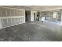 Large unfinished living room adjoining kitchen, ready for customization and finishing at 82 W Emily Gardens Dr, Selma, NC 27577