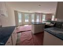 Bright eat-in kitchen featuring an island, recessed lighting, and stainless steel appliances at 83 W Emily Gardens Dr, Selma, NC 27576