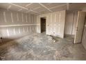 Spacious living room is under construction, with drywall installed and a doorway visible at 83 W Emily Gardens Dr, Selma, NC 27576