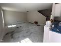 Open-concept living space with stairs leading to a second story at 83 W Emily Gardens Dr, Selma, NC 27576