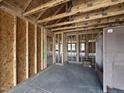 Framed interior shows the layout, and a concrete slab is visible in the new construction at 89 W Emily Gardens Dr, Selma, NC 27576