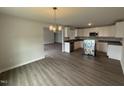 Open-concept kitchen with modern appliances, stainless steel dishwasher, and plenty of countertop space at 89 W Emily Gardens Dr, Selma, NC 27576