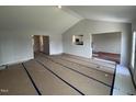 Spacious living room featuring an open floor plan with a view into the kitchen at 89 W Emily Gardens Dr, Selma, NC 27576