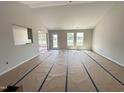 Spacious living room featuring white walls, lots of windows and great natural light at 89 W Emily Gardens Dr, Selma, NC 27576