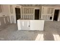 Partially complete kitchen featuring drywall and a large island for ample counter space and meal preparation at 9 W Emily Gardens Dr, Selma, NC 27576