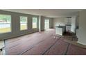 Spacious living area with large windows, a sliding glass door, and an island ready to be installed at 9 W Emily Gardens Dr, Selma, NC 27576