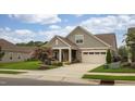 Beautiful craftsman-style home with lush landscaping and a well-maintained front yard at 1005 Vesper Ct, Durham, NC 27703