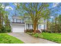 Traditional-style home with lush front lawn and attached garage, perfect for suburban living at 101 Elk River Ct. Ct, Mebane, NC 27302
