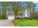 Traditional-style home with lush front lawn and attached garage, perfect for suburban living at 101 Elk River Ct. Ct, Mebane, NC 27302