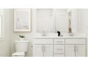 Bright bathroom features double sinks, white cabinetry, and modern decor at 103 Ellsworth Ct # 175, Garner, NC 27529