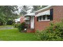 Exterior showcasing the brick facade and covered entrance of the property at 1210 Cypress St, Rocky Mount, NC 27801