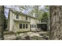 Back exterior showcasing the deck with a screened porch, perfect for outdoor entertaining and relaxation at 1505 Starmont Dr, Hillsborough, NC 27278