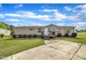 Charming single-story house featuring a cozy front porch, complemented by a well-maintained lawn and concrete driveway at 162 E Abbey Ct, Smithfield, NC 27577