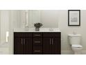 Modern bathroom featuring a double sink vanity with dark cabinetry and a stylish plant at 189 Tennyson Dr # 236, Garner, NC 27529